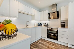 Oven, dishwasher, highchair, cookware/dishes/utensils