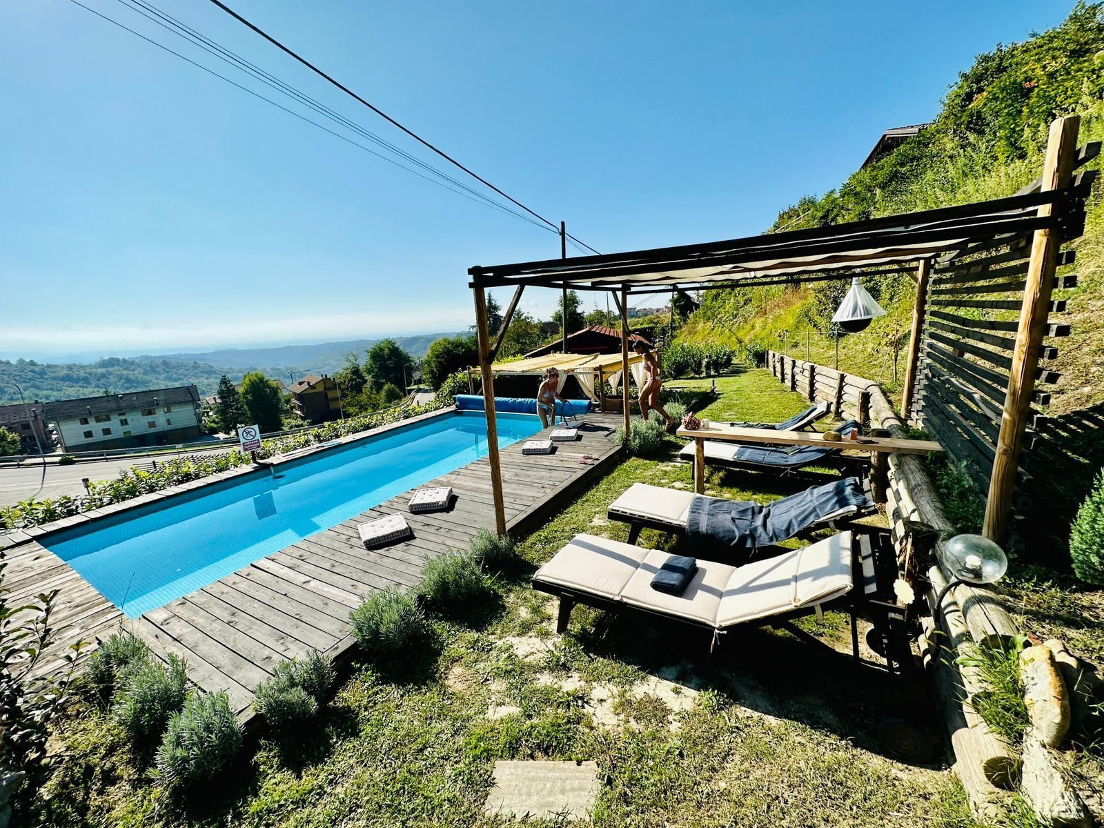 Seasonal outdoor pool, open 11:00 AM to 8:00 PM, pool umbrellas