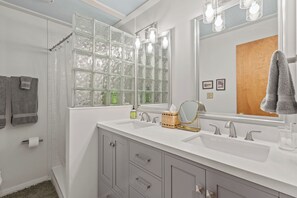 Hair dryer, towels, shampoo, toilet paper