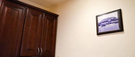 A kitchen with wooden cabinets and a refrigerator.