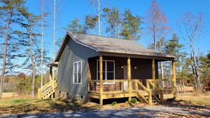 A small cabin with a wooden deck and a stone foundation. - New cabin- access to horse trails, Pilot Mtn & Hanging Rock St. Pks (Pinnacle)