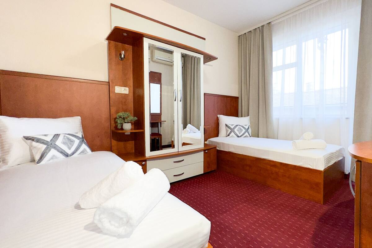 Standard Double or Twin Room | Desk, blackout drapes, iron/ironing board (on request), WiFi (free)
