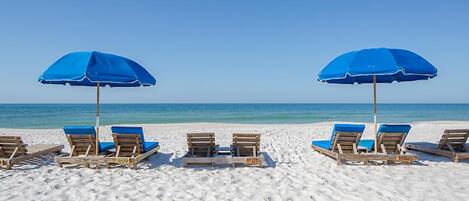 On the beach, sun-loungers, beach towels
