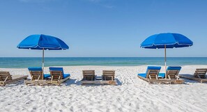 On the beach, sun loungers, beach towels