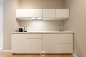 Fridge, microwave, stovetop, coffee/tea maker