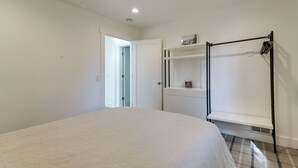 A bedroom with a bed, a wardrobe, a shelf, and a coat rack. - Steps to Beach: Family Home w/ Views in Tahoe City (Tahoe City)