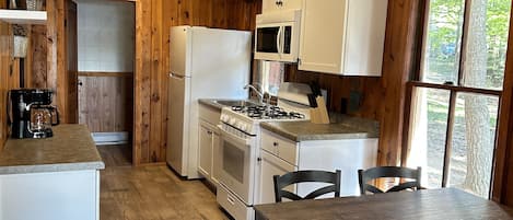 Fridge, microwave, toaster, cookware/dishes/utensils