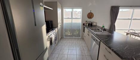 Coffee/tea maker, fridge, microwave, oven