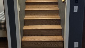 A wooden staircase with a handrail, leading to an upper floor. - Commander`s Cabin - Family Friendly Adventure (Sulphur)