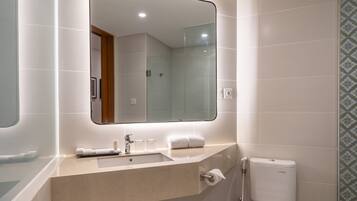 Suite room | Bathroom | Free toiletries, hair dryer, slippers