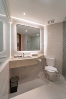 Suite room | Bathroom | Free toiletries, hair dryer, slippers
