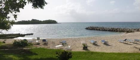 On the beach, sun-loungers, beach towels