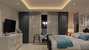 Un dormitorio moderno con una cama, televisión, escritorio y una silla.