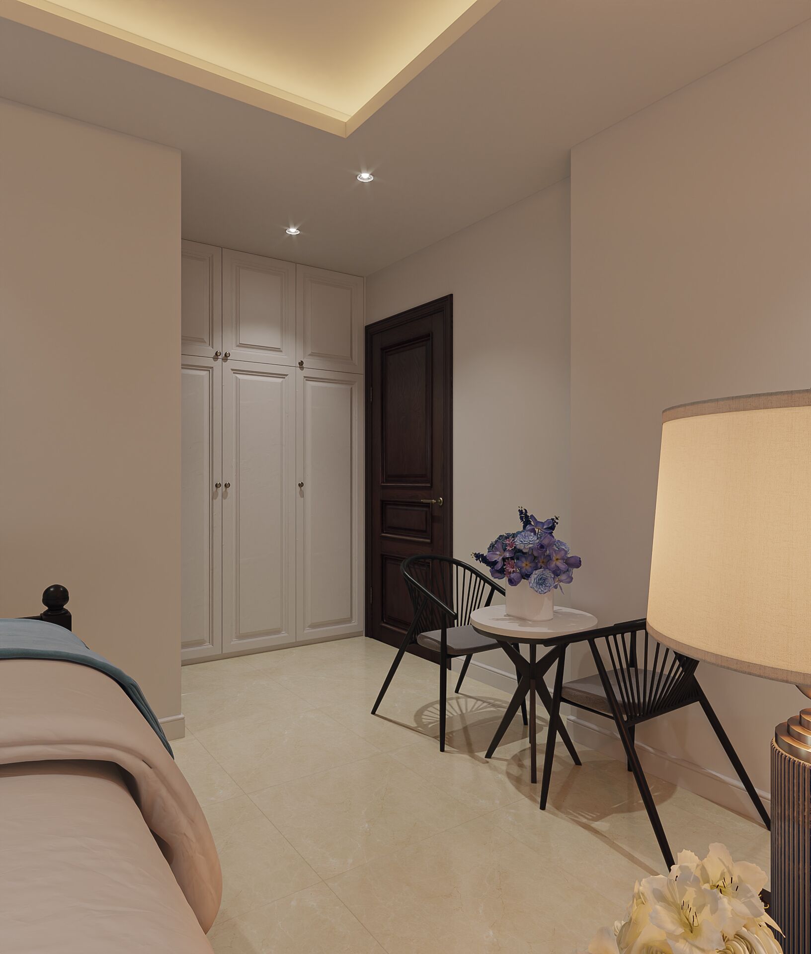 A bedroom with a bed, a desk with a chair, a lamp, and a door.