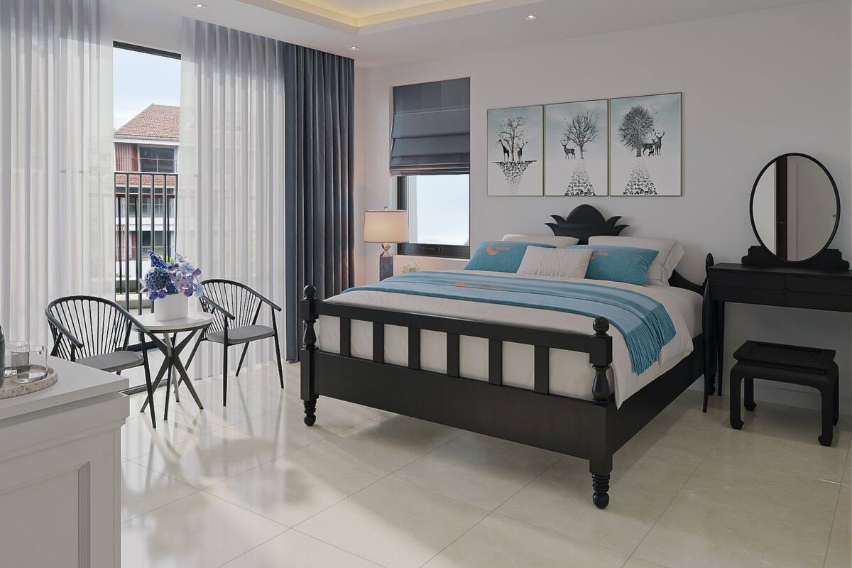 A modern bedroom with a large bed, a dining area, and a view of the outside.