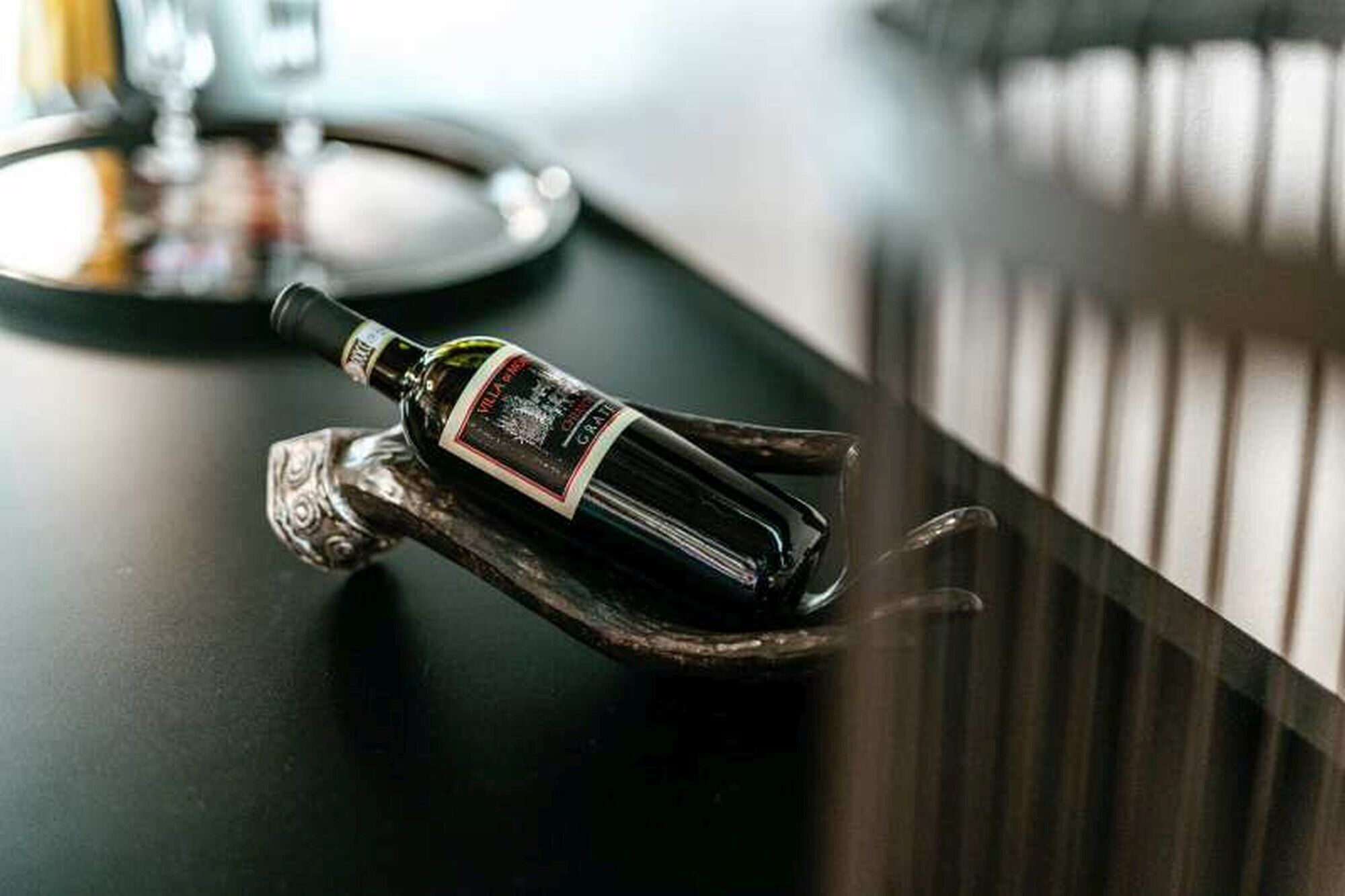 A bottle of wine on a bar counter.