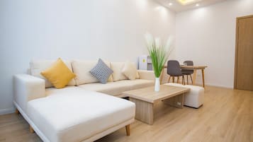 City Double Room, 2 Bedrooms | Living area | 56-inch LCD TV with cable channels, fireplace