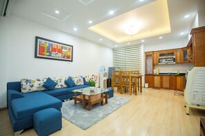 Deluxe Apartment | Living area | 56-inch LCD TV with cable channels, fireplace - Sumitomo 12 - 535 Kim Ma (Hanoi)
