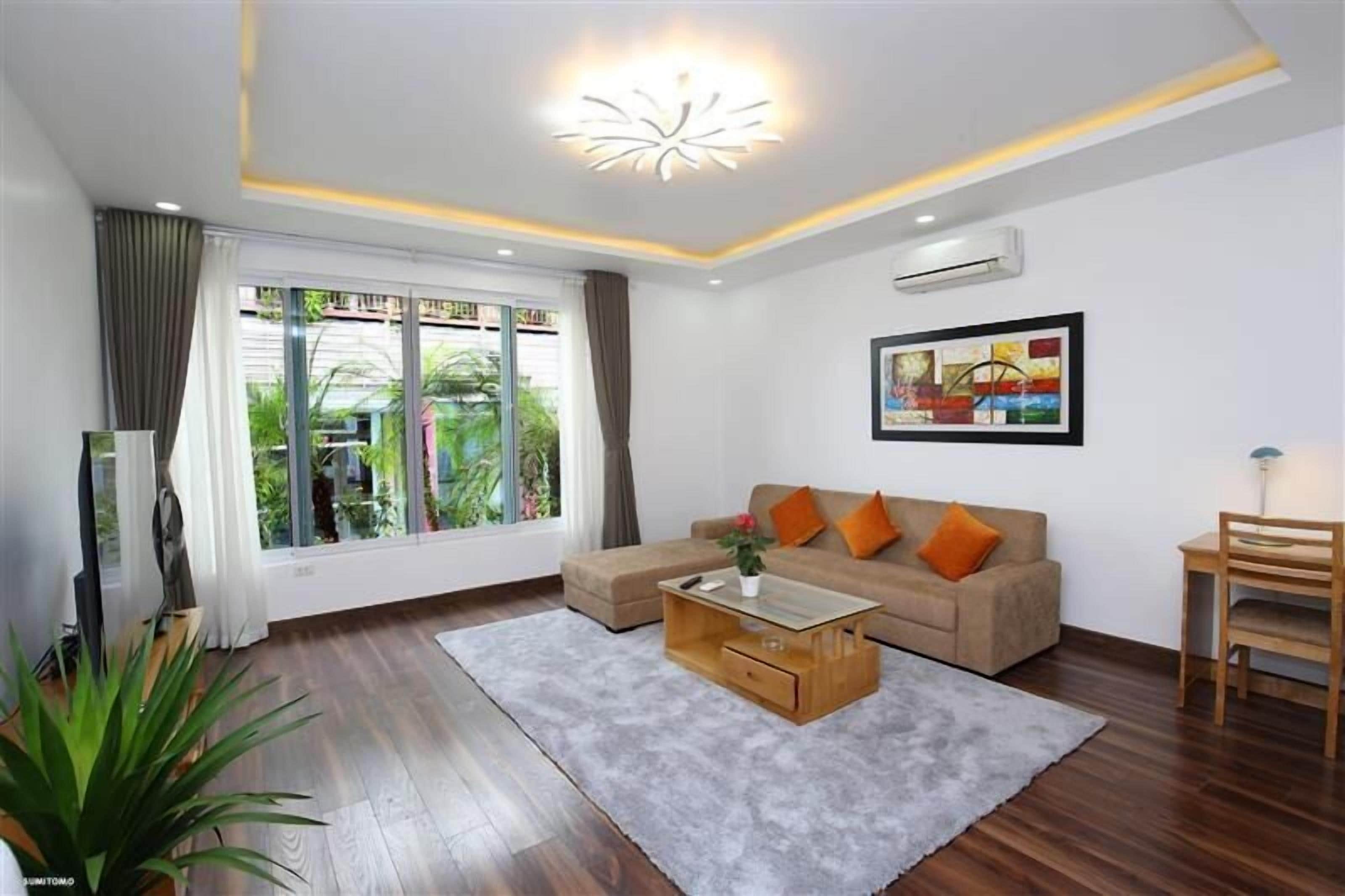 Executive Apartment, 1 Bedroom | Living area | 56-inch LCD TV with cable channels, fireplace
