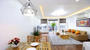 City Apartment | Living area | 56-inch LCD TV with cable channels, fireplace