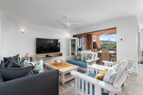 Superior Villa | Living area | 50-inch flat-screen TV with satellite channels - San Lameer Villa 2825 (Southbroom)