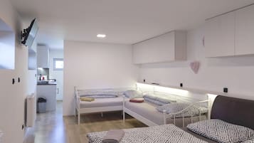 Estudio | Camas Tempur-Pedic, escritorio y espacio para trabajar con laptop