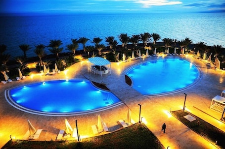 Indoor pool, 2 outdoor pools, open 8:30 AM to 11:30 PM, pool umbrellas. GADILEH RESORT HOTEL