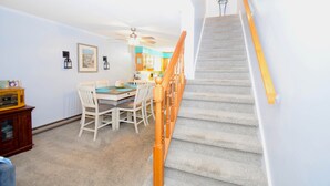 A staircase with wooden handrails leading to a landing. - Nanticoke Square 207B-Bayside 142nd St, Pool, W/D, AC, Free WIFI (Ocean City)