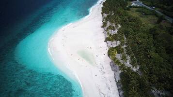 Beach nearby, white sand, beach shuttle, sun loungers