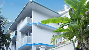 A multi-story building with balconies and a white facade. - Silver County Fuvahmulah (Fuvahmulah)