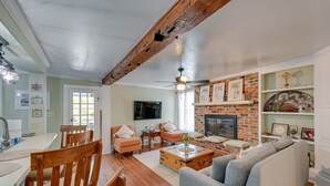 Apartment (2 Bedrooms) | Living area | TV, books - Convenient New Bern Apt With Patio Access! (New Bern)
