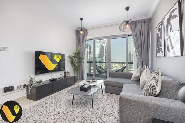 Elite Apartment | Living area | 65-inch Smart TV with cable channels - Vogue Blvd Walk near Burj Khalifa/ Dubai Mall (Dubai)
