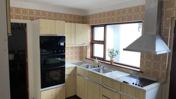 House, Multiple Beds | Private kitchen | Fridge, microwave, oven, stovetop