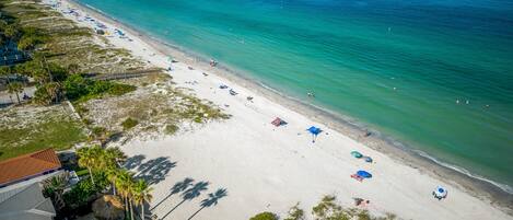 On the beach, sun loungers, beach towels
