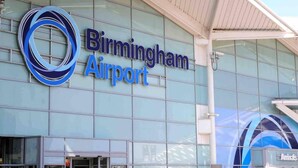 The exterior of Birmingham Airport with a large blue and white logo and signage. - Closetocitycentre&nec-business&family-freeparking (Solihull)