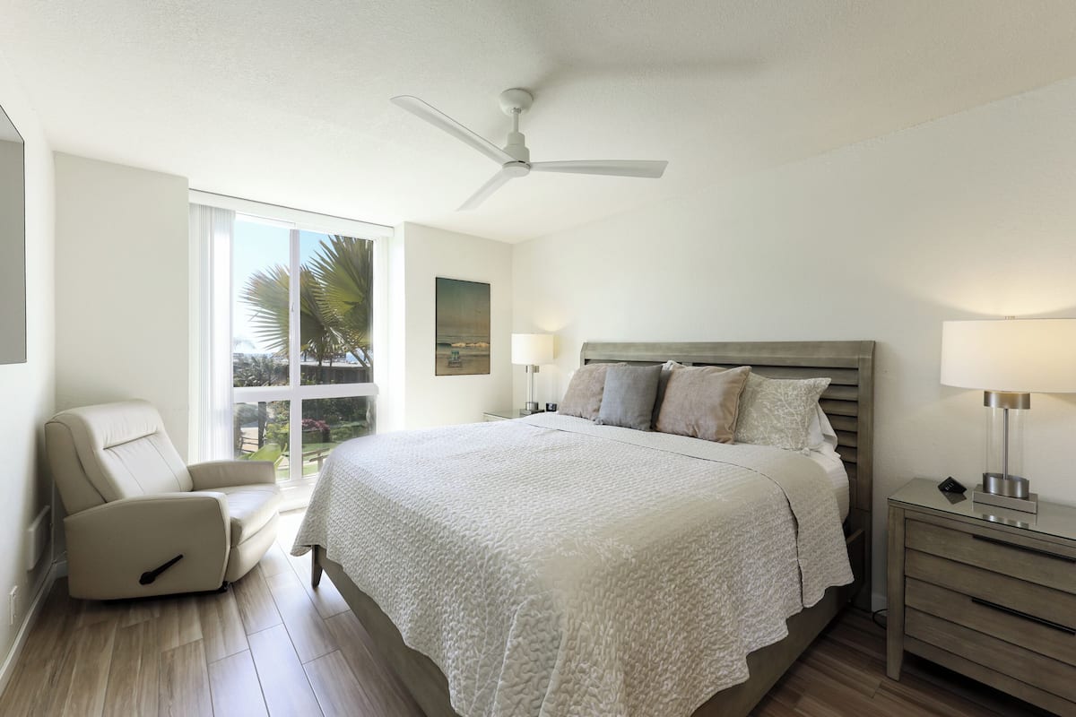 Condo, 1 King Bed with Sofa bed, Pool Access, Garden View (E108) | 1 bedroom, individually decorated, individually furnished, bed sheets