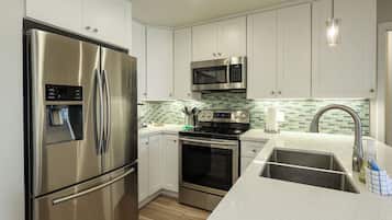 Condo, 1 King Bed with Sofa bed, Pool Access, Garden View (E108) | Private kitchen | Coffee/tea maker