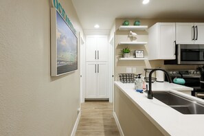 Condo, 1 Queen Bed with Sofa bed, Pool Access, Garden View (G122 ) | Private kitchen | Fridge, microwave, oven, stovetop