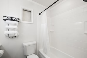 Combined shower/tub, hair dryer, towels, soap