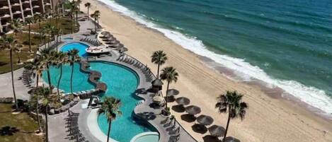 On the beach, sun-loungers