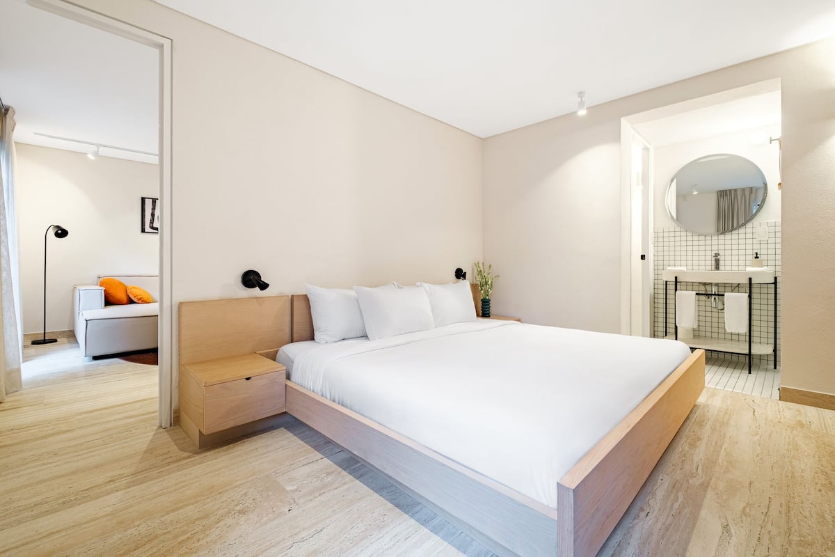 Elite Apartment, 2 Bedrooms | 1 bedroom, down comforters, in-room safe, individually decorated