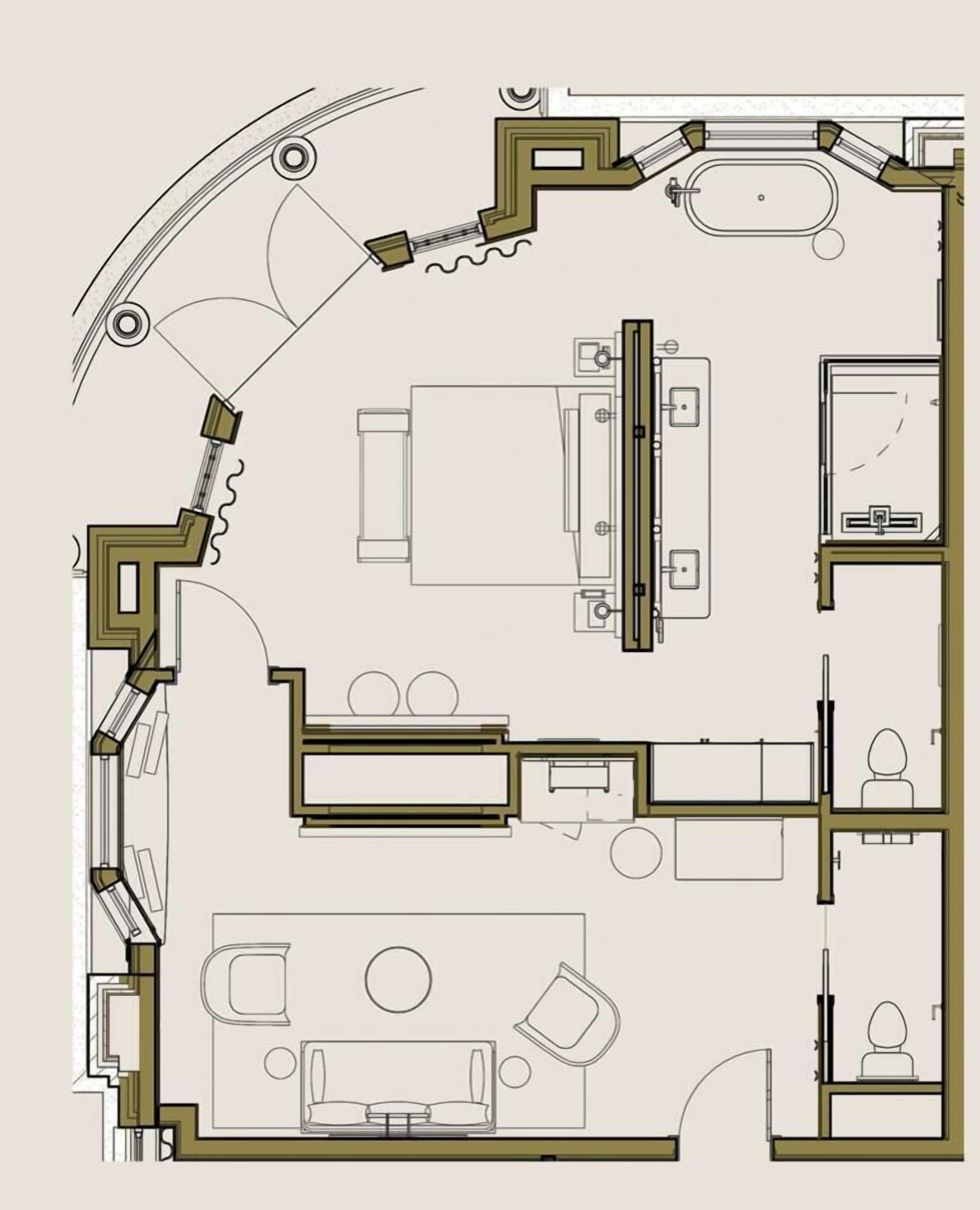 Un plan d’étage d’une chambre d’hôtel comprenant une salle de bain, un coin salon avec un canapé et une table, et un lit.
