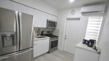 Full-sized fridge, microwave, toaster, coffee grinder