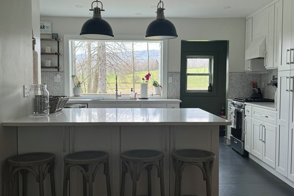 The kitchen and window facing the meadow and working farm to the west.