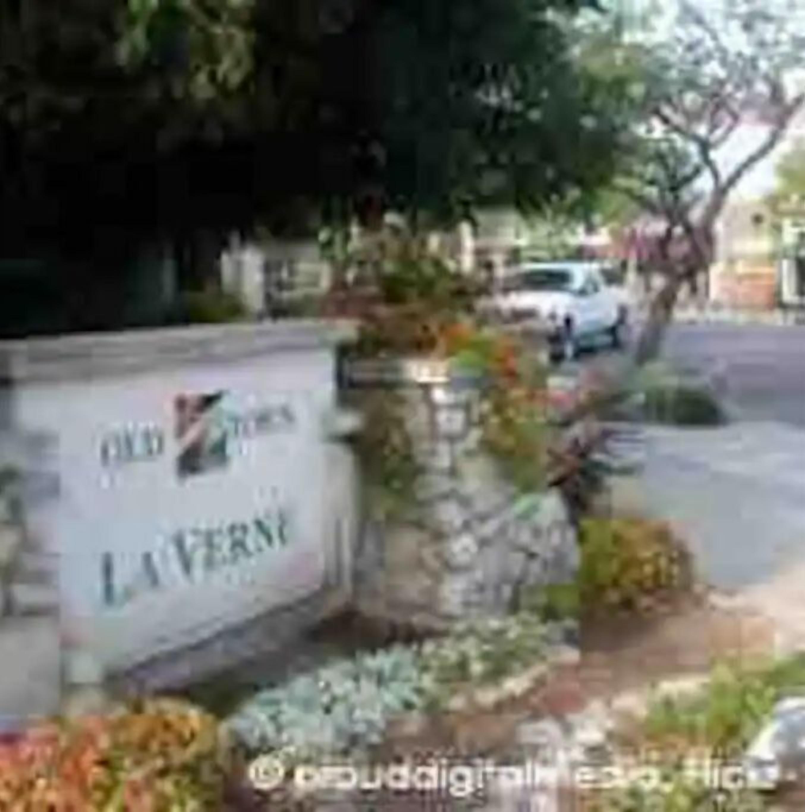 A sign with the name 'Old Town LAVERN' indicating a location.