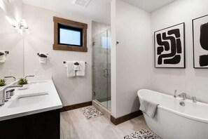 Shower, hair dryer, towels, shampoo