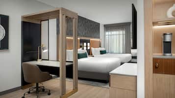 Hypo-allergenic bedding, desk, laptop workspace, blackout drapes