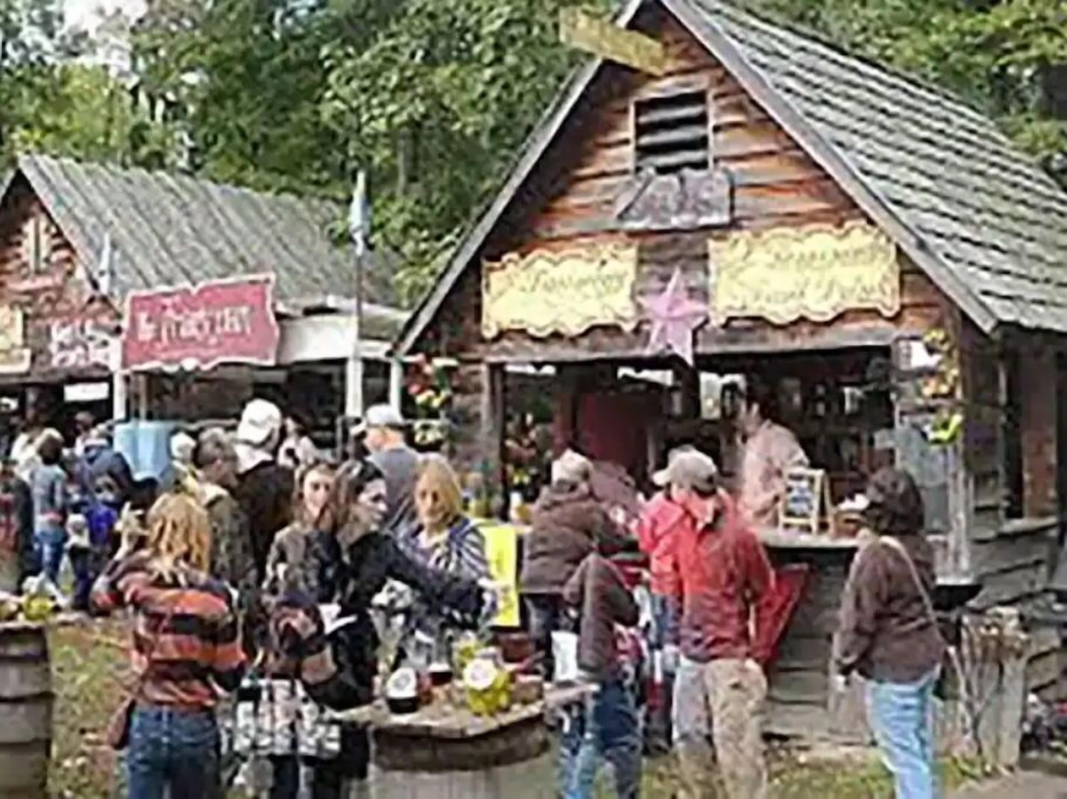 A rustic wooden building with a sign that reads "The Ranch."