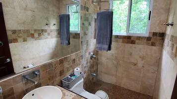 Shower, towels, soap, toilet paper