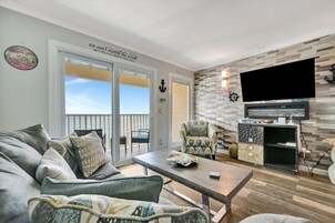 Panoramic Apartment, Fireplace, Bay View | Living area | 55-inch Smart TV with digital channels